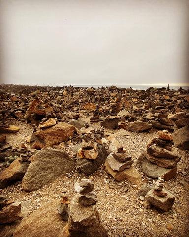 Rock cairns near the sea wall near Morro Rock in Morro Bay on California's Central coast in San Luis Obispo county 