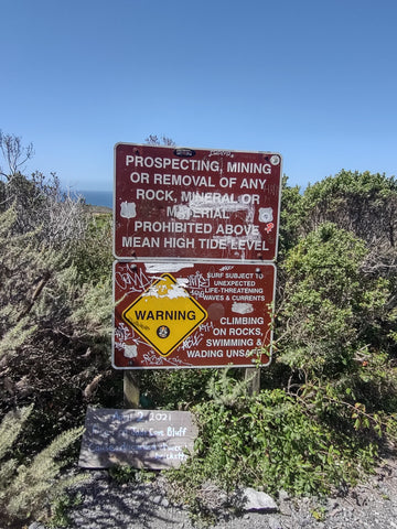 Sign at Jade Cove in Central California Coast near Big Sur explaining where to pick up Jade while rockhounding