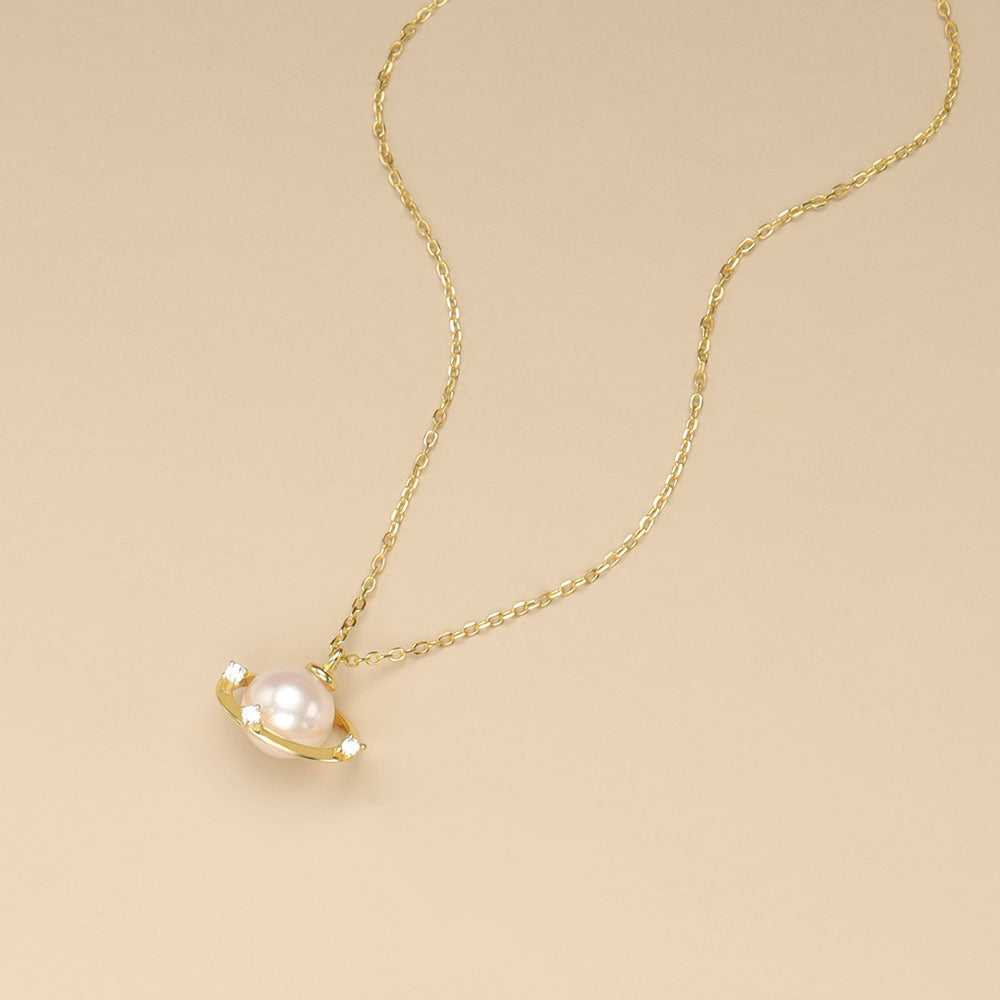 gold saturn pearl necklace