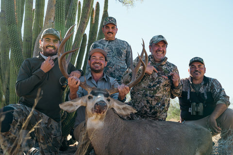 Group of People With Hunted Prey