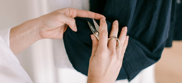 Thread Snips being used to finish a garment