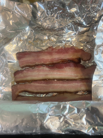 thick cut applewood smoked bacon half-cooked for grilling