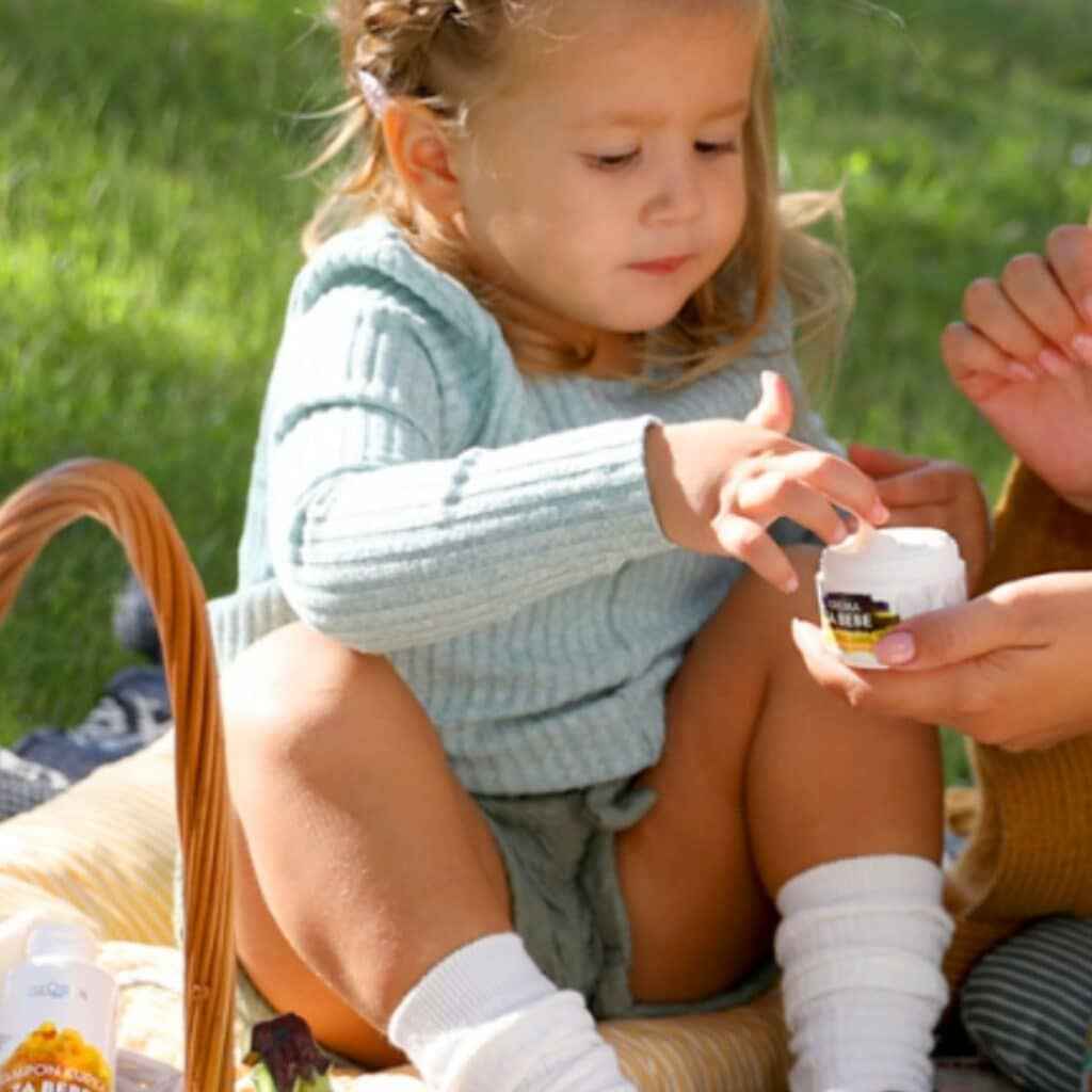 little girl holding natural cosmetics