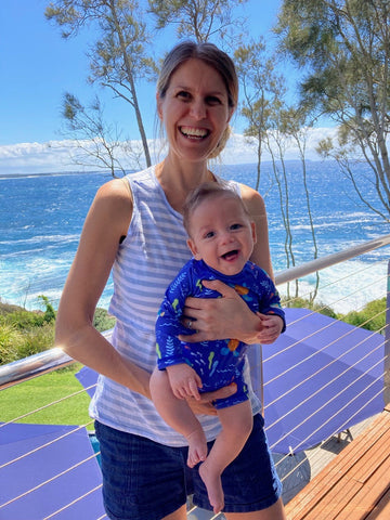 Mum and baby smiling and happy