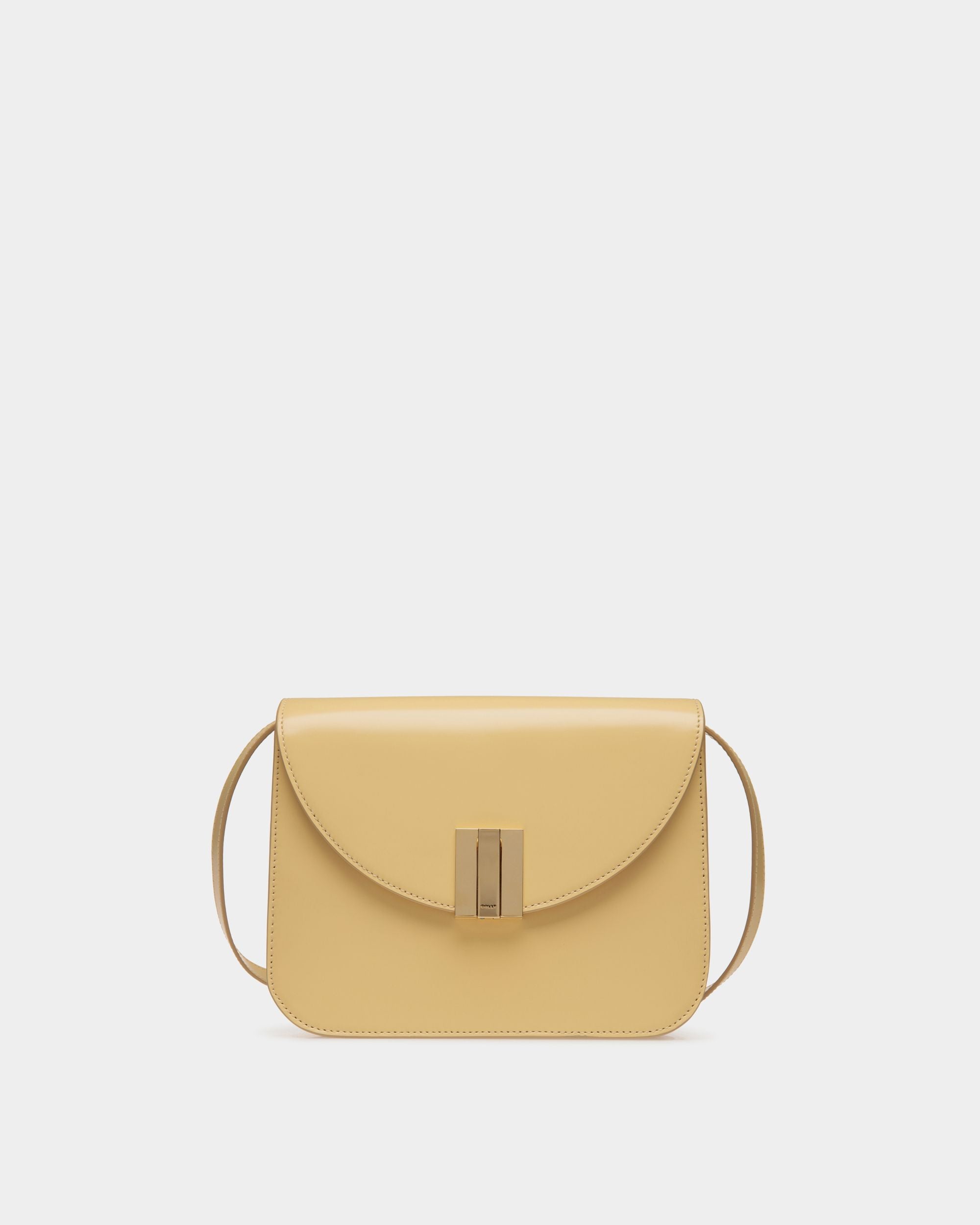 Ollam | Women's Crossbody Bag in Cream Brushed Leather | Bally | Still Life Front