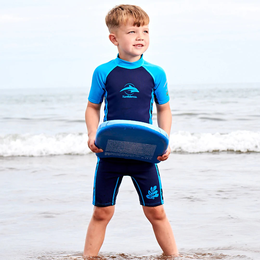 Boy in a wetsuit bathing on a southern holiday