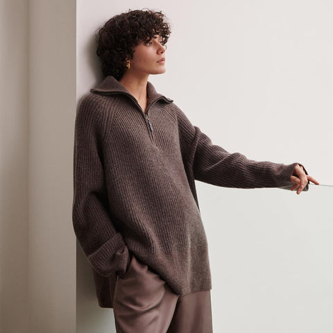 Image of a model wearing a chocolate coloured cashmere wool half zip