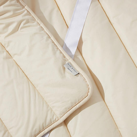 a close up of a mattress protector showing the elastic strap