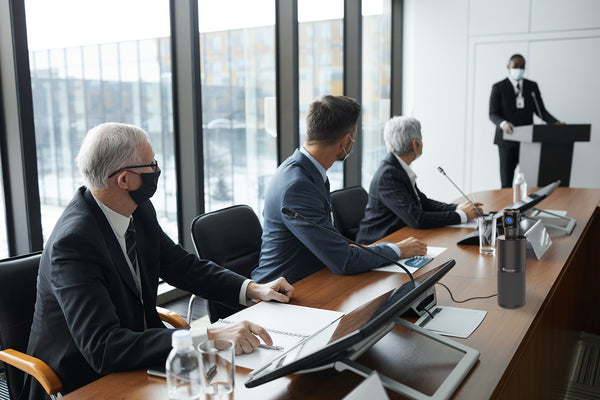 Toucan Video Conference System 360 on table in a government office conference room