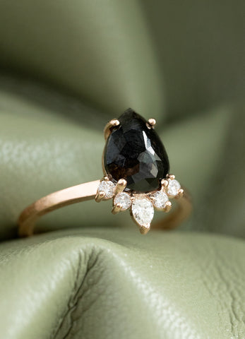 Black pear diamond ring in rose gold with a crown of clear diamonds 