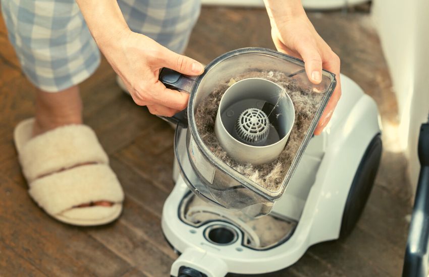 Full-sized vacuum getting cleaned out