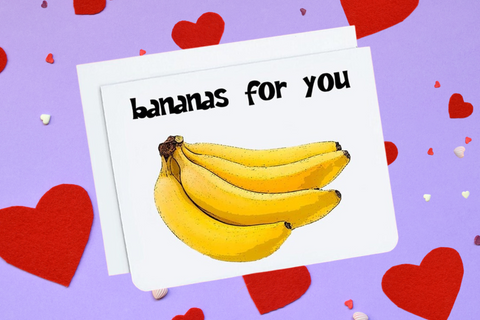 A photo of a Valentines Card. It has a bunch of bananas on it. Text reads, 'bananas for you.'