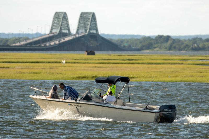 A fishing boat traveling on water