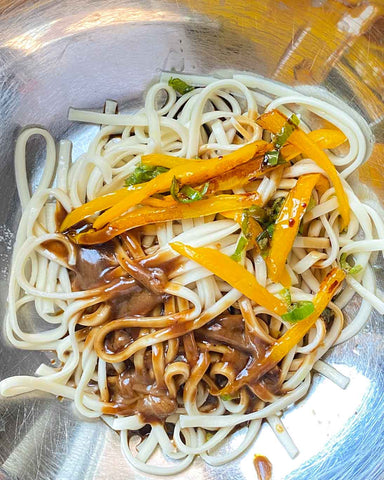 Coconut Noodle dish with peppers, coconut spread or Filipino Coconut Jam. Similar to the Thai Peanut Pad Thai with peanut sauce
