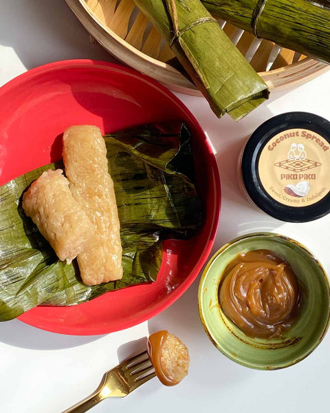 Suman Malagkit (Steamed, sticky rice cake) with coconut spread