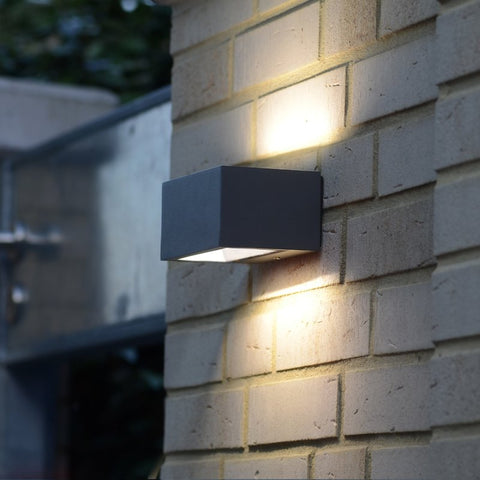 An up & down outdoor wall light mounted outside.