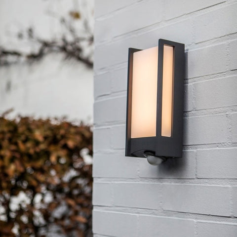 A PIR outdoor light mounted on an exterior wall.