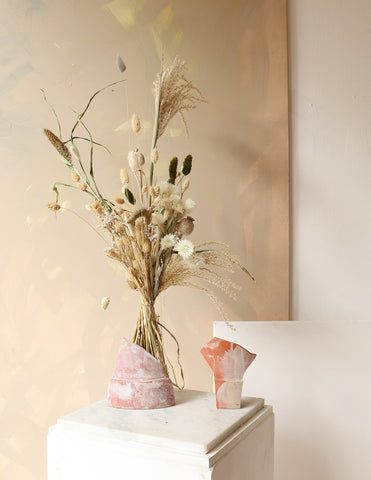 Photograph of a dried flower bouquet bouquet with natural grasses, poppyseeds and white flowers
