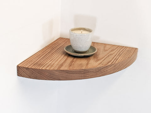 An oak floating corner shelf