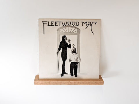 A vinyl record floating shelf. A Fleetwood Mac record is displayed on the shelf