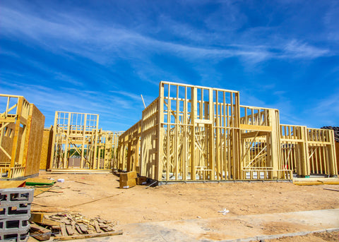 A construction site with wooden wall studs exposed