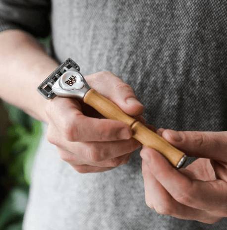 Man holding Original Bamboo Razor