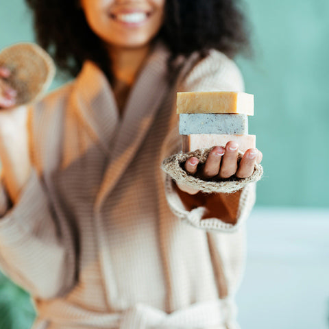 happy woman holding shower steamers