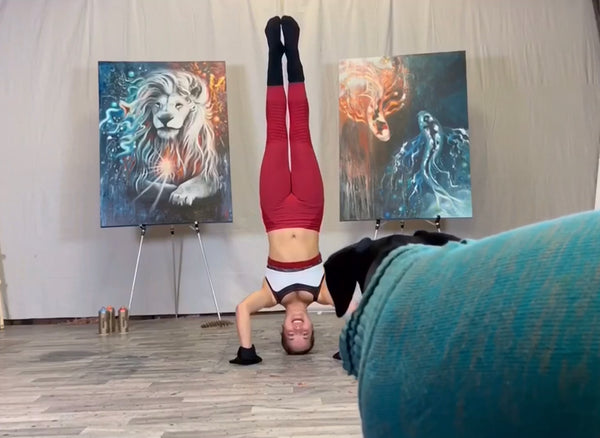 @bri_fitzpatrick , multidisciplinary artist, Briana Fitzpatrick, artist who paints with her feet, contortion artist, archery artist, barn studio, artist studio, artist in studio, Doberman pinscher puppy