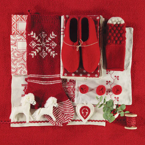 picture with red handcrafted items, mittens, socks, fabrics, folk patterns