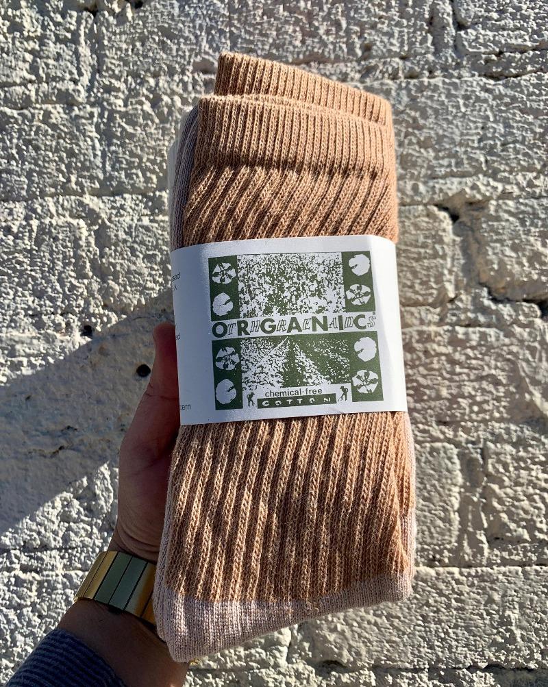 The best socks ever and eco-friendly! Enjoy the comfort of organic cotton grown by Sally Fox and manufactured in the U.S.A. These comfy socks are roomy and made from organic cotton that grows naturally in earth tone colors, no dye here! Air dry or dry in low heat if they're a little big -  then they will shrink to fit! size 9-11  Three pairs of earth tone socks to a pack.