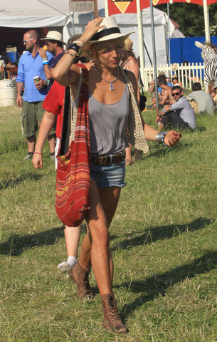 Sienna Miller in denim cut offs at Glastonbury 2010