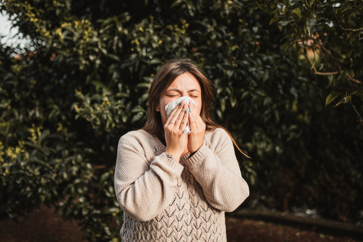 Woman coughing and sneezing