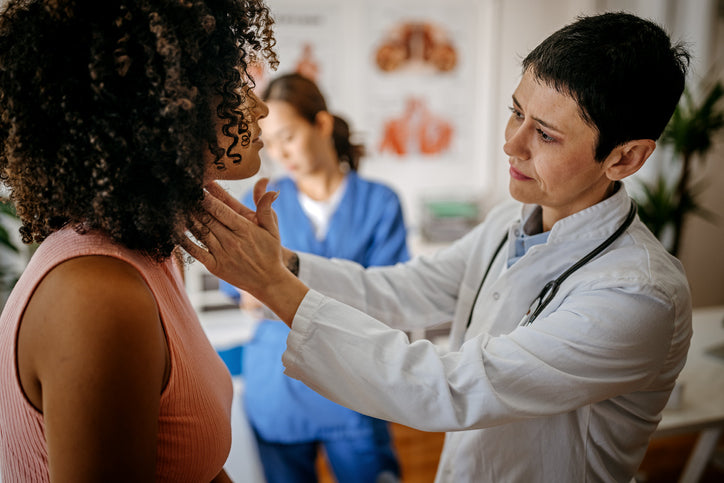 Woman having thyroid checked