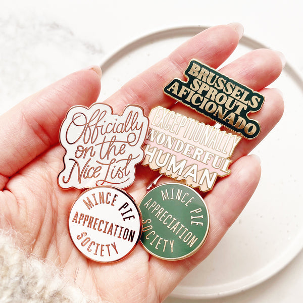 Festive enamel pin badges