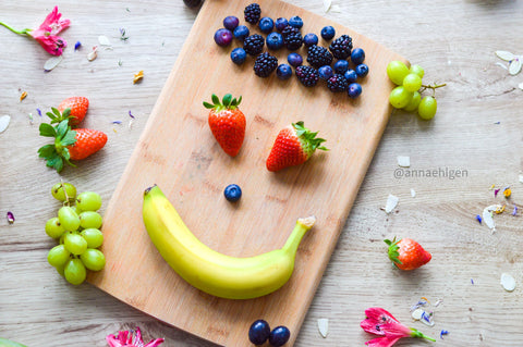 friendly face made of fruit from the Try it children's cookbook