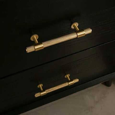 gold handles black cabinet