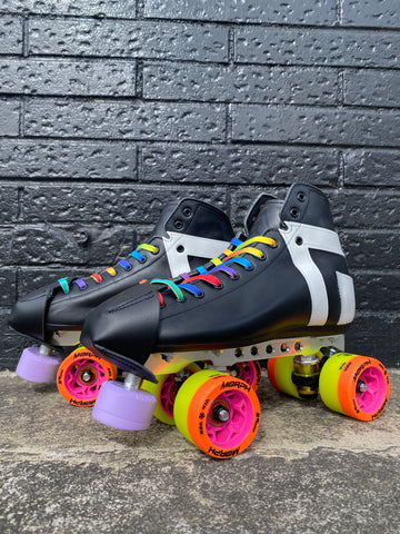 A pair of black roller derby skates, with colourful laces, orange and yellow wheels and a purple toe stop