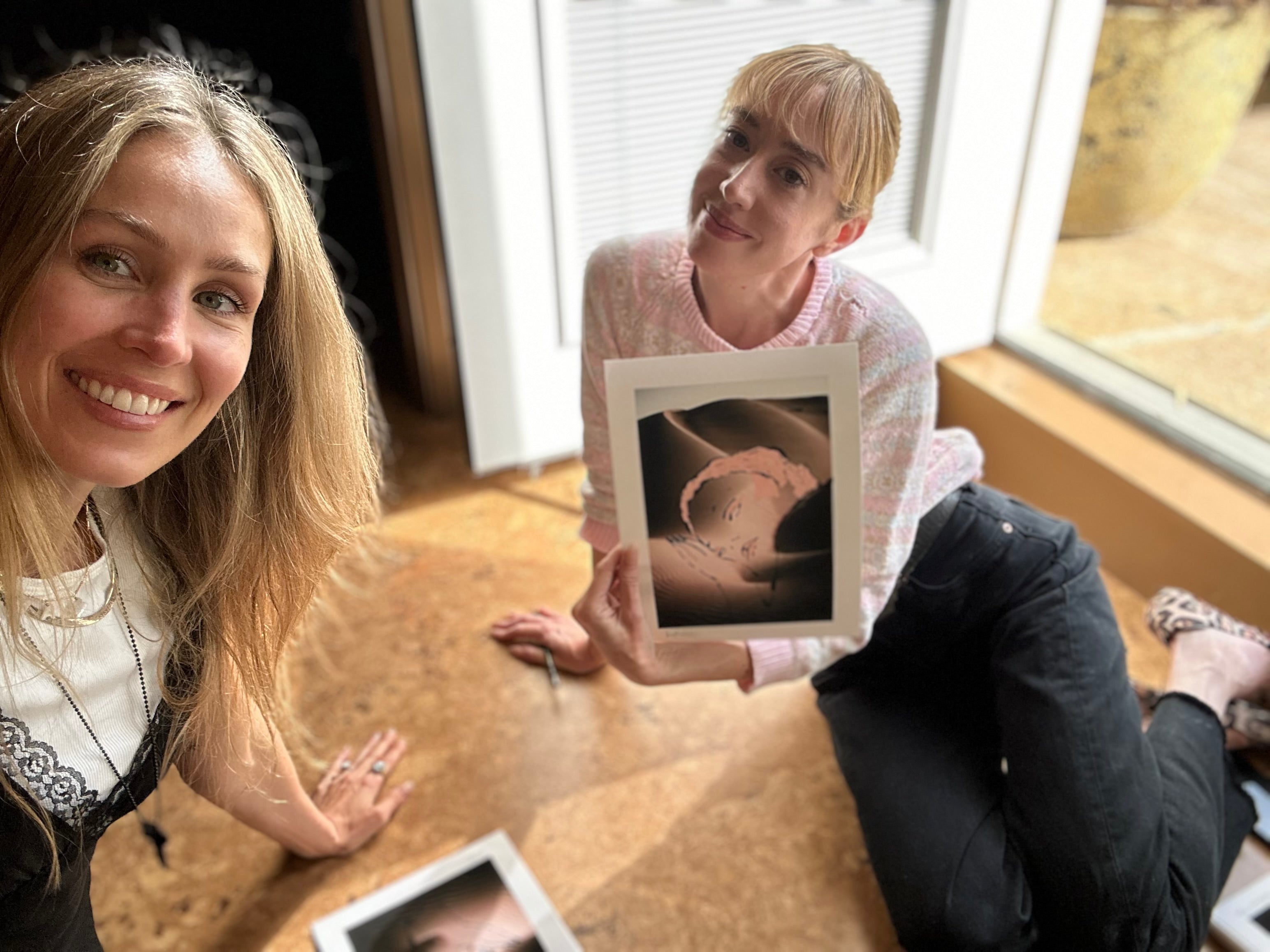 artists natalie krim and kathryn boyd brolin together during the signing of their collaborative prints