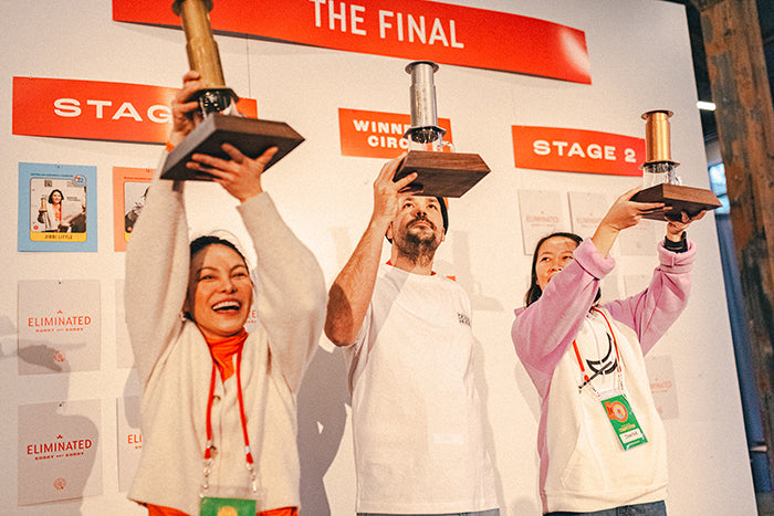 The 2022 World AeroPress Champions lift their trophies