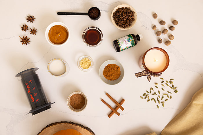 AeroPress Original and pumpkin spice latte ingredients on kitchen counter