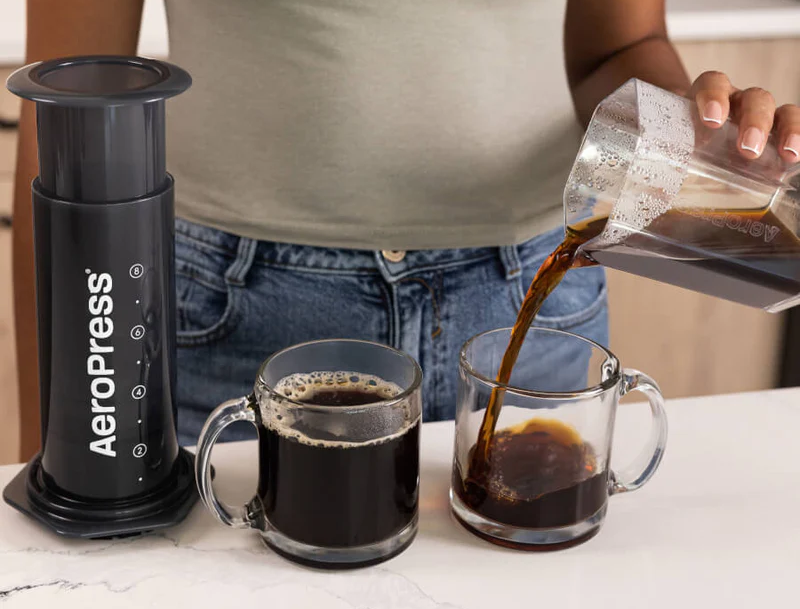 AeroPress XL and carafe pouring two cups of coffee