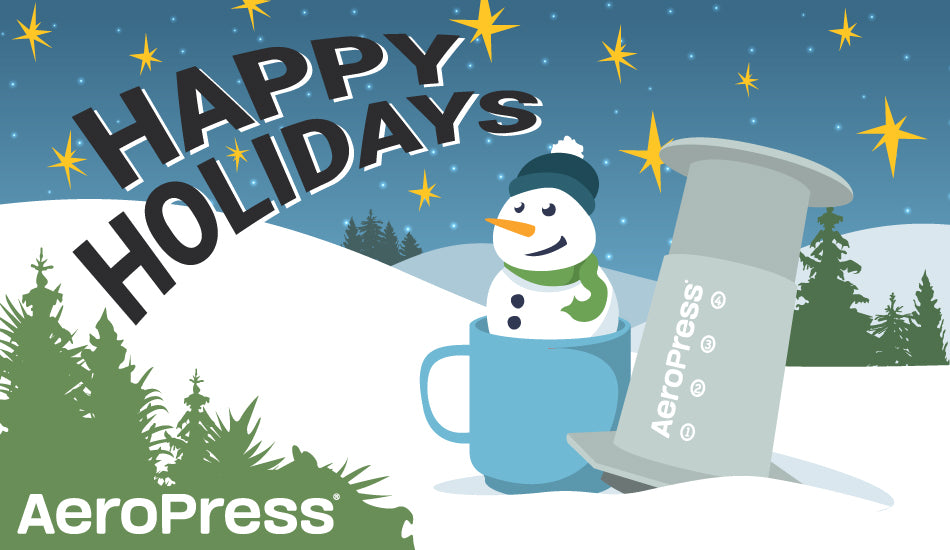 Gift card graphic showing snowman, mug, AeroPress coffee maker and the phrase Happy Holidays