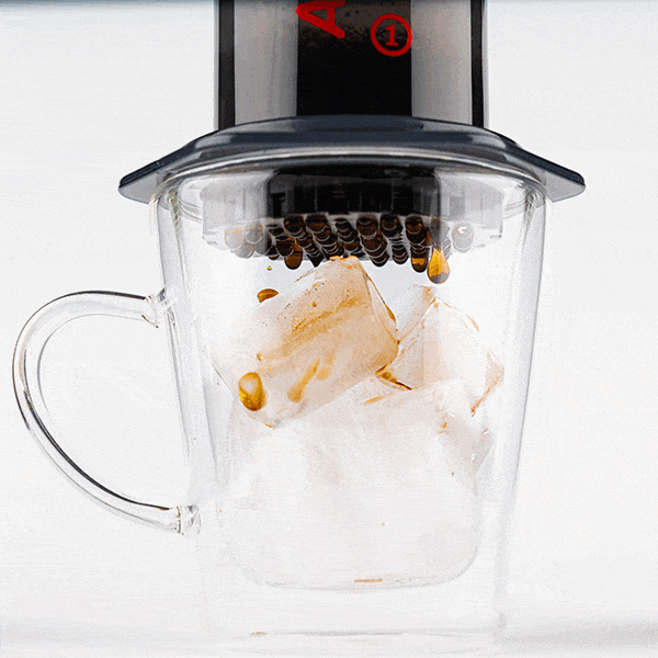 Gif showing process of flash brewed iced coffee being brewed with AeroPress Original into mug full of ice