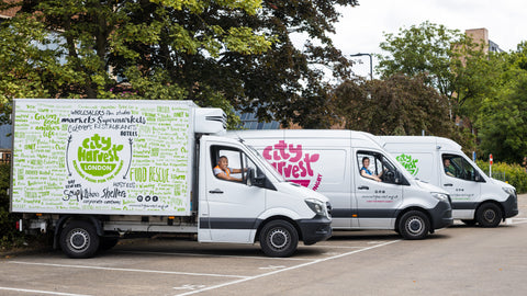 City Harvest London vans leave to distribute food to over 350 charities and groups