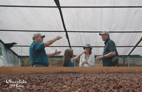 The Chocolate and Love family in the drying tunnel on a visit to a cacao farm in Dominican Republic.