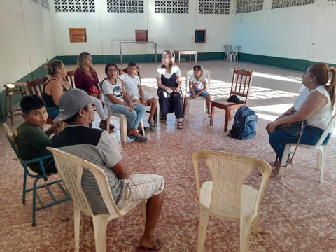 Sarah runs an introductory session for the children's music therapy group.