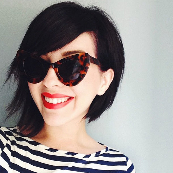 cute-layered-bob-with-red-lipstick-and-cat-eye-sunglasses
