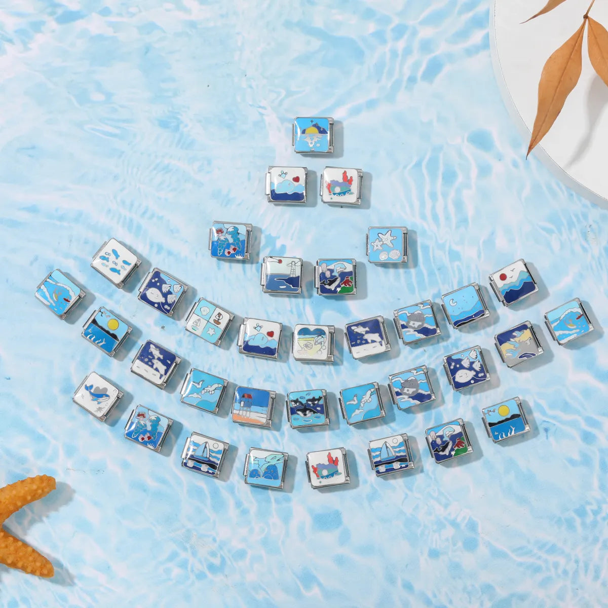 Woman wearing a summer italian charm bracelet with sea-inspired italian charms.
