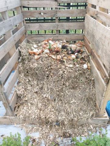 This open air compost pile is one way to compost chicken manure.