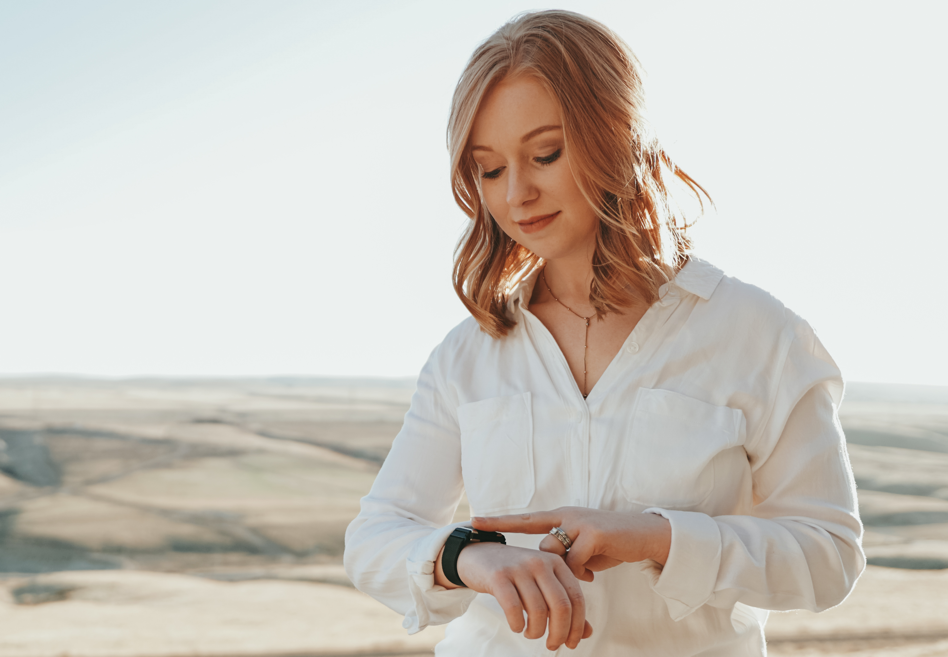 A Lady giving herself snap from pavlok band